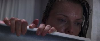 Movie still from “What Lies Beneath” (2000), directed by Robert Zemeckis – A woman leaning on a wall with her hand on the wall; Extreme Close Up shot, Overhead angle