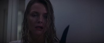 Movie still from “What Lies Beneath” (2000), directed by Robert Zemeckis – A person holding a knife; Close Up shot, Low angle