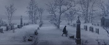 Movie still from “What Lies Beneath” (2000), directed by Robert Zemeckis – A person walking through a cemetery in the snow; Extreme Wide shot, High angle