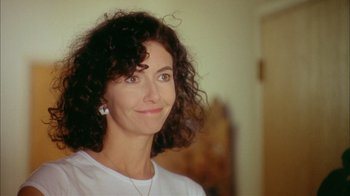 Movie still from “What's Eating Gilbert Grape” (1993), directed by Lasse Hallström – A person wearing a white shirt; Close Up shot, Over the shoulder angle