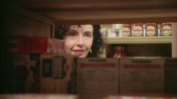 Movie still from “What's Eating Gilbert Grape” (1993), directed by Lasse Hallström – A woman is looking out of a refrigerator; Close Up shot, Over the shoulder angle