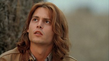 Movie still from “What's Eating Gilbert Grape” (1993), directed by Lasse Hallström – A person with long brown hair; Close Up shot, Low angle