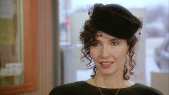 Movie still from “What's Eating Gilbert Grape” (1993), directed by Lasse Hallström – A person wearing a hat; Close Up shot, Over the shoulder angle