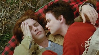 Movie still from “What's Eating Gilbert Grape” (1993), directed by Lasse Hallström – A man and a woman laying in the grass; Close Up shot, Overhead angle
