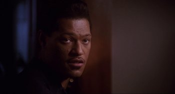 Movie still from “What's Love Got to Do with It” (1993), directed by Brian Gibson – A person wearing a black shirt; Close Up shot, Low angle