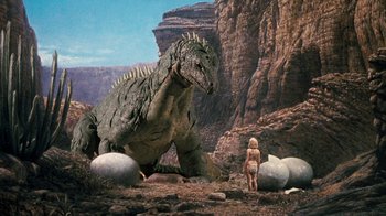 Movie still from “When Dinosaurs Ruled the Earth” (1970), directed by Val Guest – An image of a child and an animal; Wide shot, High angle