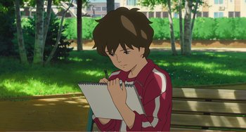 Movie still from “When Marnie Was There” (2014), directed by Hiromasa Yonebayashi – A boy is writing on a piece of paper; Medium shot, High angle