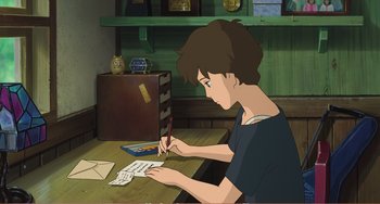Movie still from “When Marnie Was There” (2014), directed by Hiromasa Yonebayashi – A person writing on a piece of paper on top of a desk; Medium shot, High angle