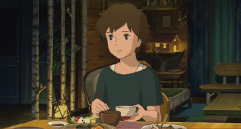 Movie still from “When Marnie Was There” (2014), directed by Hiromasa Yonebayashi – A person sitting at a table with a bowl of food; Medium shot, High angle
