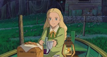 Movie still from “When Marnie Was There” (2014), directed by Hiromasa Yonebayashi – A woman sitting at a table holding a cup; Medium shot, High angle