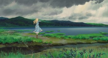 Movie still from “When Marnie Was There” (2014), directed by Hiromasa Yonebayashi – A woman standing on the shore of a body of water; Extreme Wide shot, High angle