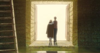 Movie still from “When Marnie Was There” (2014), directed by Hiromasa Yonebayashi – Two people are standing in a doorway looking at the light; Wide shot, High angle