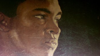 Movie still from “When We Were Kings” (1996), directed by Leon Gast – A man's face in a painting; Extreme Close Up shot, Low angle
