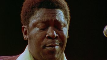 Movie still from “When We Were Kings” (1996), directed by Leon Gast – A person with his eyes closed; Extreme Close Up shot, Low angle