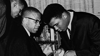 Movie still from “When We Were Kings” (1996), directed by Leon Gast – A black - and - white photo of two men looking at each other; Close Up shot, Low angle