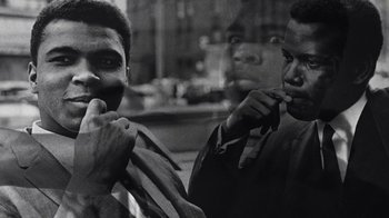 Movie still from “When We Were Kings” (1996), directed by Leon Gast – A black and white photo of two men brushing their teeth; Close Up shot, Low angle