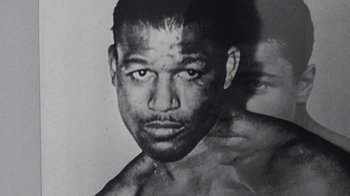Movie still from “When We Were Kings” (1996), directed by Leon Gast – A black and white photo of a man's face; Extreme Close Up shot, Low angle