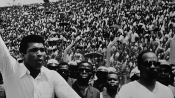 Movie still from “When We Were Kings” (1996), directed by Leon Gast – Black and white photograph of a crowd of people in a stadium; Close Up shot, High angle