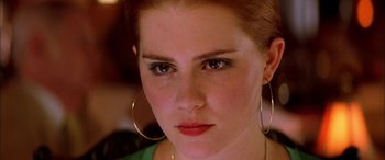 Movie still from “Where the Truth Lies” (2005), directed by Atom Egoyan – A person wearing a green shirt; Close Up shot, Over the shoulder angle