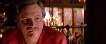 Movie still from “Where the Truth Lies” (2005), directed by Atom Egoyan – A person wearing a red jacket; Close Up shot, Over the shoulder angle