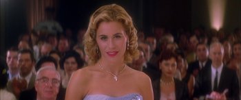 Movie still from “Where the Truth Lies” (2005), directed by Atom Egoyan – A woman in a blue dress and a diamond necklace; Close Up shot, Over the shoulder angle