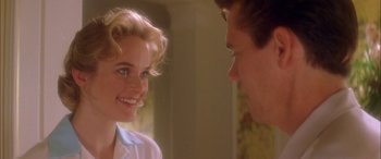 Movie still from “Where the Truth Lies” (2005), directed by Atom Egoyan – A man and a woman smiling at each other; Close Up shot, Over the shoulder angle