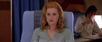 Movie still from “Where the Truth Lies” (2005), directed by Atom Egoyan – A person sitting in a chair; Close Up shot, High angle