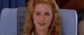 Movie still from “Where the Truth Lies” (2005), directed by Atom Egoyan – A woman with red hair; Close Up shot, Over the shoulder angle