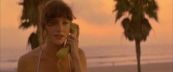 Movie still from “Where the Truth Lies” (2005), directed by Atom Egoyan – A beautiful young woman holding a phone to her ear; Close Up shot, Low angle