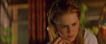 Movie still from “Where the Truth Lies” (2005), directed by Atom Egoyan – A woman holding a phone up to her ear; Close Up shot, High angle
