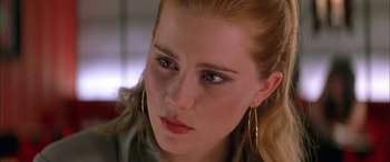 Movie still from “Where the Truth Lies” (2005), directed by Atom Egoyan – A person wearing a green shirt; Close Up shot, Over the shoulder angle