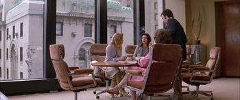 Movie still from “Where the Truth Lies” (2005), directed by Atom Egoyan – A group of people sitting at a table in front of a window; Wide shot, High angle