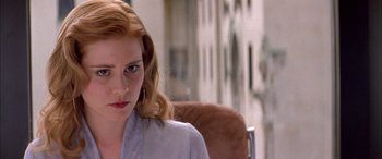 Movie still from “Where the Truth Lies” (2005), directed by Atom Egoyan – A person sitting on a chair; Close Up shot, Over the shoulder angle