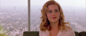 Movie still from “Where the Truth Lies” (2005), directed by Atom Egoyan – A person sitting in a chair; Close Up shot, Over the shoulder angle