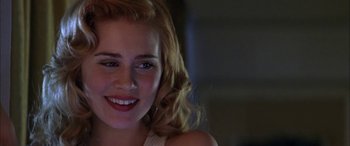 Movie still from “Where the Truth Lies” (2005), directed by Atom Egoyan – A person smiling; Close Up shot, Over the shoulder angle