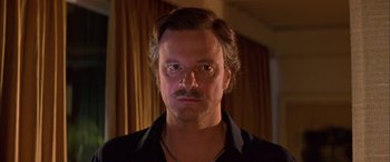 Movie still from “Where the Truth Lies” (2005), directed by Atom Egoyan – A person with a mustache; Close Up shot, Low angle