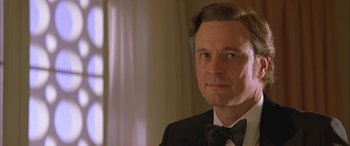 Movie still from “Where the Truth Lies” (2005), directed by Atom Egoyan – A person wearing a suit and bow tie; Close Up shot, Low angle
