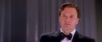 Movie still from “Where the Truth Lies” (2005), directed by Atom Egoyan – A person wearing a suit and a bow tie; Close Up shot, Low angle