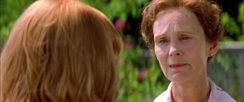 Movie still from “Where the Truth Lies” (2005), directed by Atom Egoyan – An older woman with red hair talking to a younger woman; Close Up shot, Over the shoulder angle