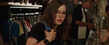 Movie still from “Whip It” (2009), directed by Drew Barrymore – A young woman with glasses and a backpack; Close Up shot, Over the shoulder angle