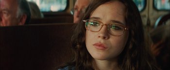 Movie still from “Whip It” (2009), directed by Drew Barrymore – A woman wearing glasses sitting in a car; Close Up shot, Over the shoulder angle