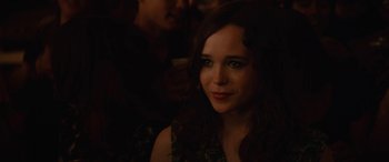 Movie still from “Whip It” (2009), directed by Drew Barrymore – A young woman is smiling for the camera; Close Up shot, Over the shoulder angle