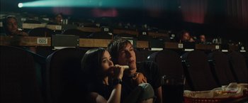 Movie still from “Whip It” (2009), directed by Drew Barrymore – A man and a woman sitting in front of each other; Medium shot, High angle