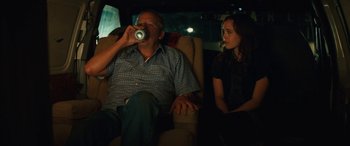 Movie still from “Whip It” (2009), directed by Drew Barrymore – A man and a woman sitting in a car; Medium shot, Over the shoulder angle