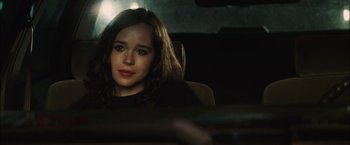 Movie still from “Whip It” (2009), directed by Drew Barrymore – A woman sitting in a car looking at the camera; Close Up shot, Over the shoulder angle