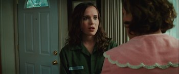 Movie still from “Whip It” (2009), directed by Drew Barrymore – A woman in a green shirt is talking to another woman; Close Up shot, Over the shoulder angle