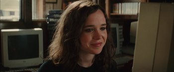 Movie still from “Whip It” (2009), directed by Drew Barrymore – A person with long brown hair; Close Up shot, Over the shoulder angle