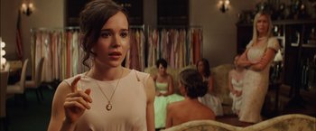 Movie still from “Whip It” (2009), directed by Drew Barrymore – A woman standing in front of a group of women; Close Up shot, Over the shoulder angle