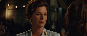 Movie still from “Whip It” (2009), directed by Drew Barrymore – A person wearing a suit; Close Up shot, Over the shoulder angle