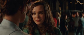 Movie still from “Whip It” (2009), directed by Drew Barrymore – A person with long brown hair; Close Up shot, Over the shoulder angle